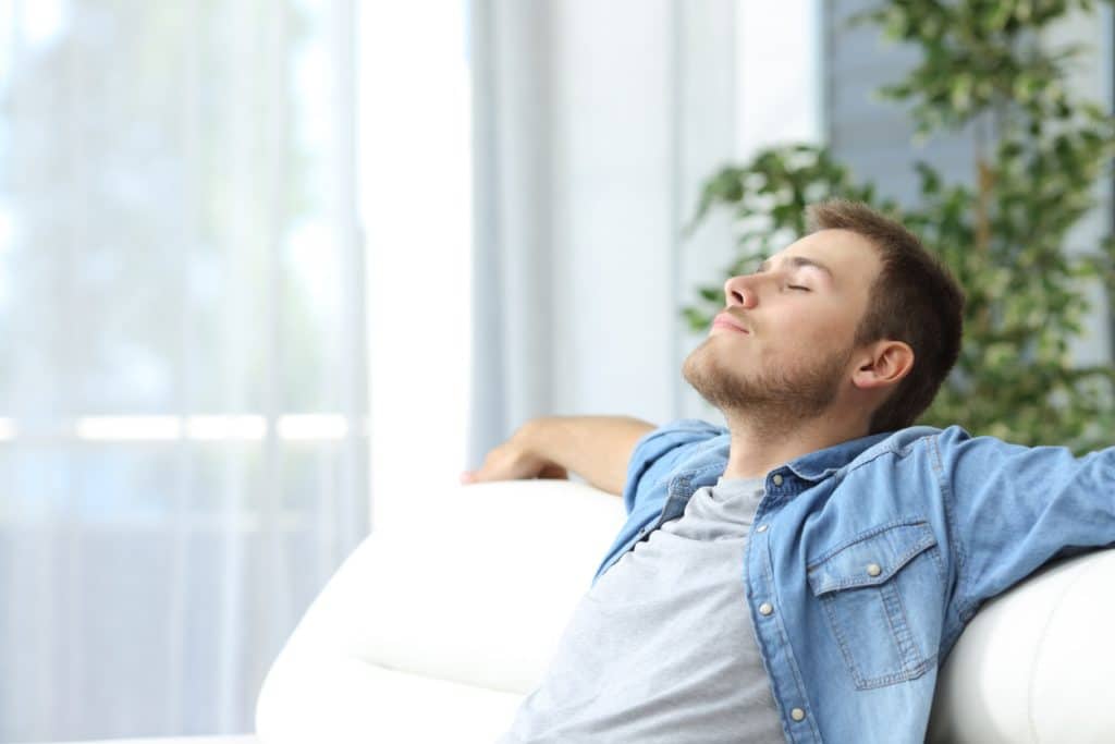 Man resting on a couch